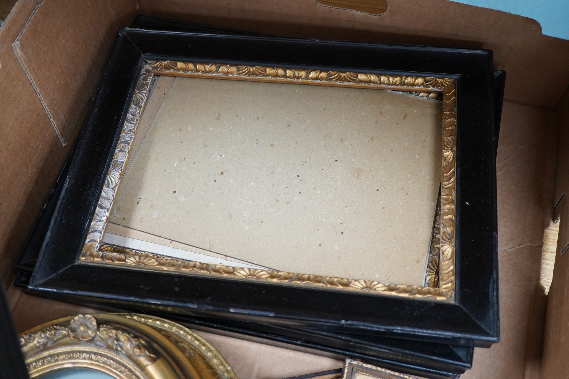 A collection of watercolour and printed miniatures and frames to include: 19th century and later oval silhouette portraits, one rosewood framed, various ebonised and partially gilt frames and a comical watercolour, hunti